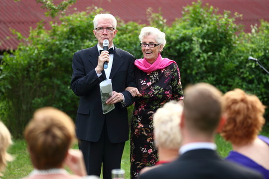 Children/senior Couple Giving A Speech For Their Children