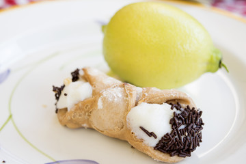 Sicilian cannolo filled with cream