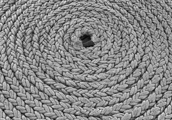 Black and white image of coiled rope.