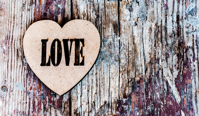 decorative heart on the background of the older wooden planks