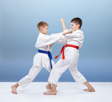 Boys are trained blocks and punches in karategi