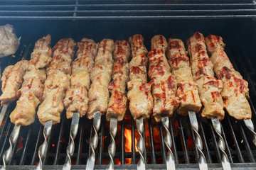 fresh hot grilled chicken shish kebab barbecue on grid over 