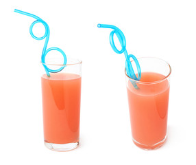 Tall glass filled with the grapefruit juice and curved blue plastic drinking straw inside. composition isolated over the white background