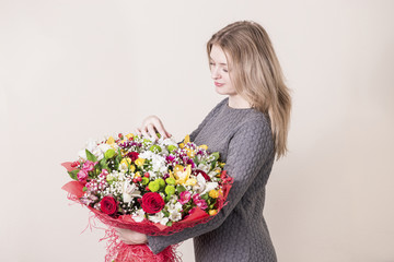 nice girl with a big bouquet of flowers