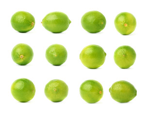 Set of multiple single limes in different compositions and foreshortenings, isolated over the white background
