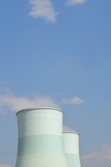 Smoking pipes of thermal power plant with cleared sky background