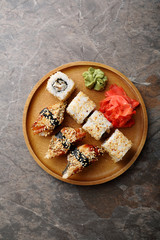 fresh rolls and sushi on plate