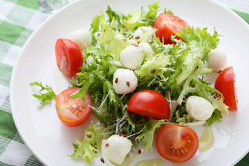 green salad on white plate