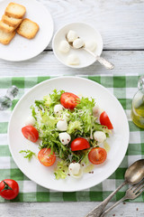 fresh salad with tomatoes on plate