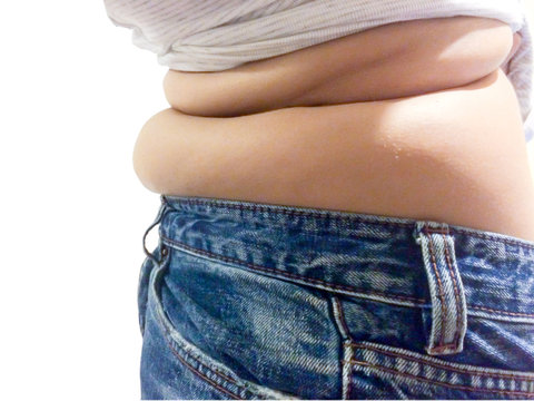 Woman  belly fat wearing pant Jeans on white isolated
