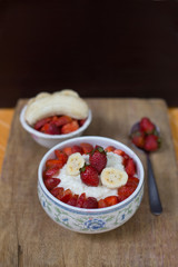 milk rice porridge with fruit strawberry and banana breakfast snack