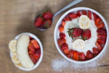 milk rice porridge with fruit strawberry and banana breakfast snack
