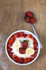 milk rice porridge with fruit strawberry and banana breakfast snack