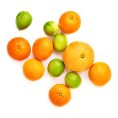 Surface covered with citrus fruits over white isolated background
