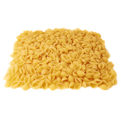 Pile of dry conchiglie pasta over isolated white background