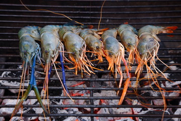 Fried big shrimps seafood on the flaming grill