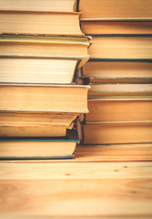 Old and used hardback books or text books seen from above.