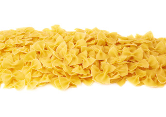 Line made of dry farfalle pasta over isolated white background