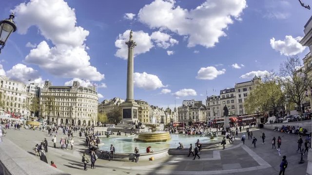 Time lapse fish eye view of Trafalgar square in London with fountains, admiral Nelson column, car traffic and people
