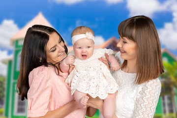 mother with daughter and aunt godmother