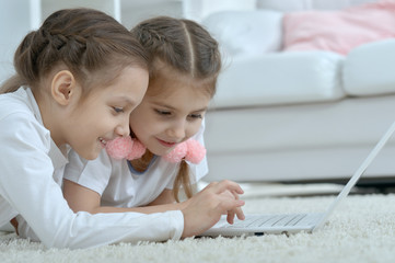 little girls looking at laptop