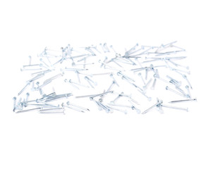 Scattered nails over surface isolated over white background