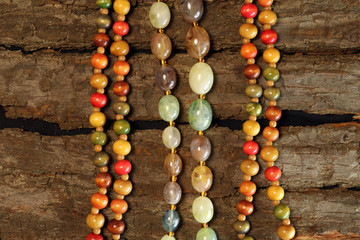 Ethnic Bead Jewellery On Wood Background