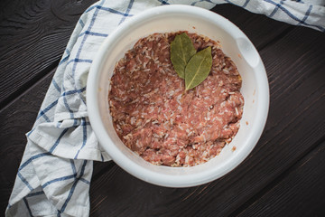 minced meat on wooden table