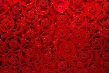 cogs gears in motion red background team work connected technology