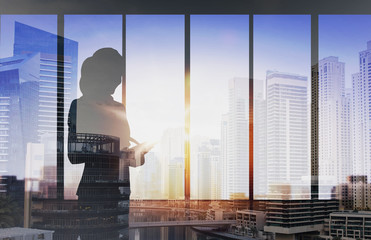 silhouette of businesswoman with tablet pc