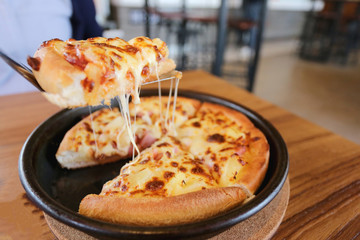 traditional of hot cheese pizza on pan.