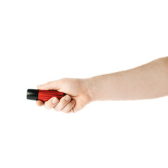 Hand holding a flashlight torch, composition isolated over the white background