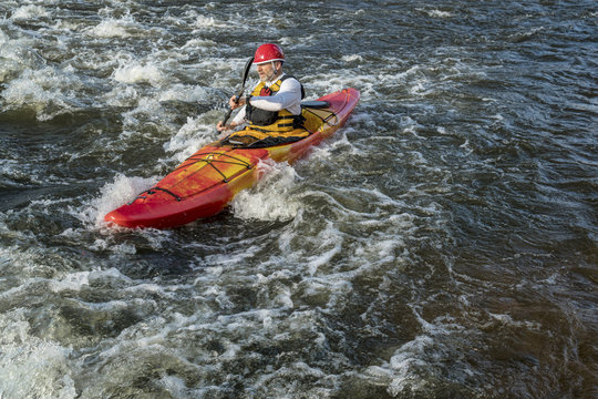paddling whitewater kayak