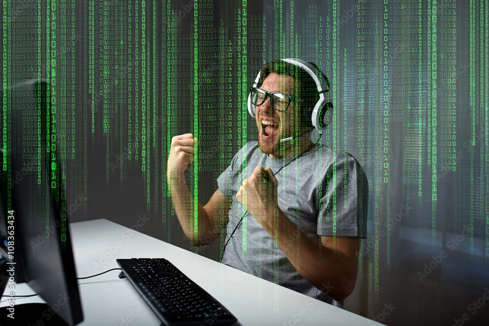 Wall mural man in headset playing computer video game at home