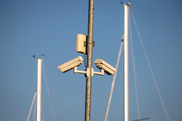 Fototapeta na wymiar Security cameras in yachting harbor
