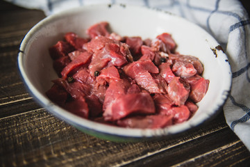 minced meat on wooden table