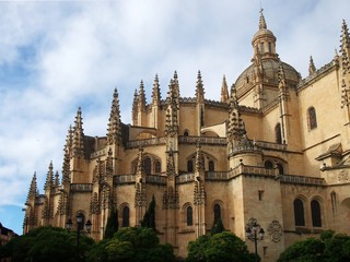 Fototapeta na wymiar Gothic style spires and dome of the Cathedral of Segovia in Castile and Leon Province of Spain