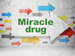 Healthcare concept: arrow with Miracle Drug on grunge wall background