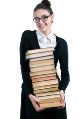 Young woman with books pile isolated on white