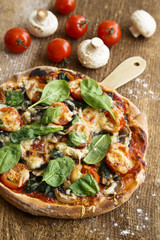 Spinach pizza with tomatoes and cheese