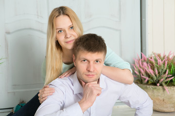 Portrait of loving young couple at home
