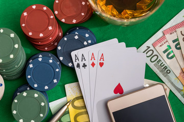 poker chips with playing card, euro money and smartphone