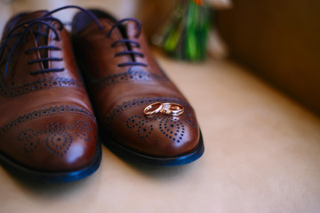 Wedding rings on men's shoes