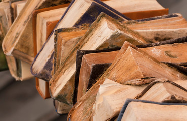 Lots of rare books stacked in huge wall in the library