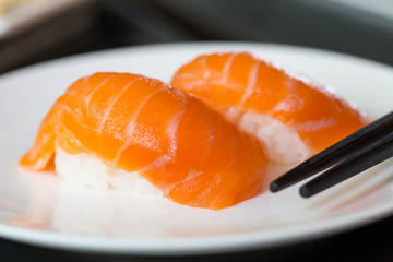 Sushi salmon on white plate