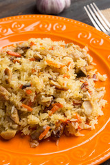 Asian pilaf on a orange plate