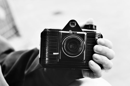 old man with an old camera, black and white