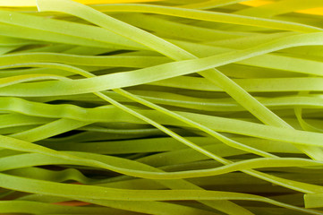Background of green raw italian pasta