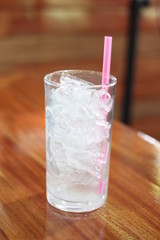 Ice in the glass is placed on the the dining table.