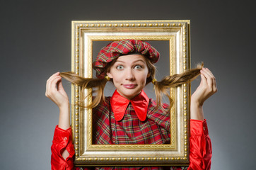Fototapeta premium Woman in scottish clothing in art concept